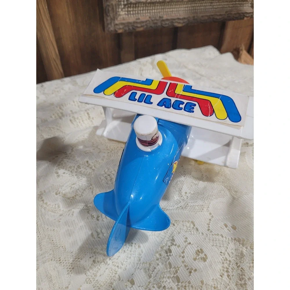 LIL ACE plastic airplane toy 1970s psychedelic stunt biplane w/ mustache man